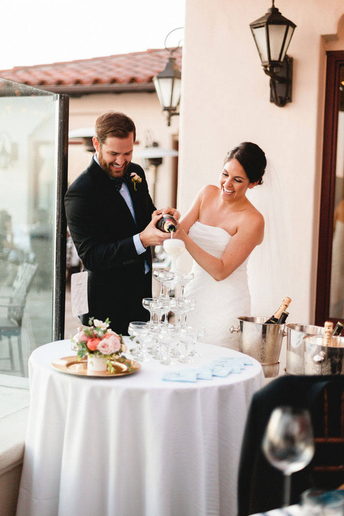 bride and groom pouring champagne tower
