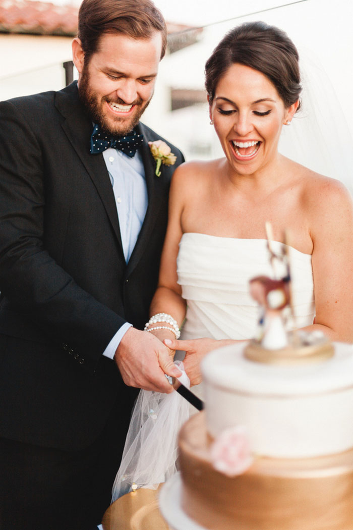 bride and groom cutting the cake