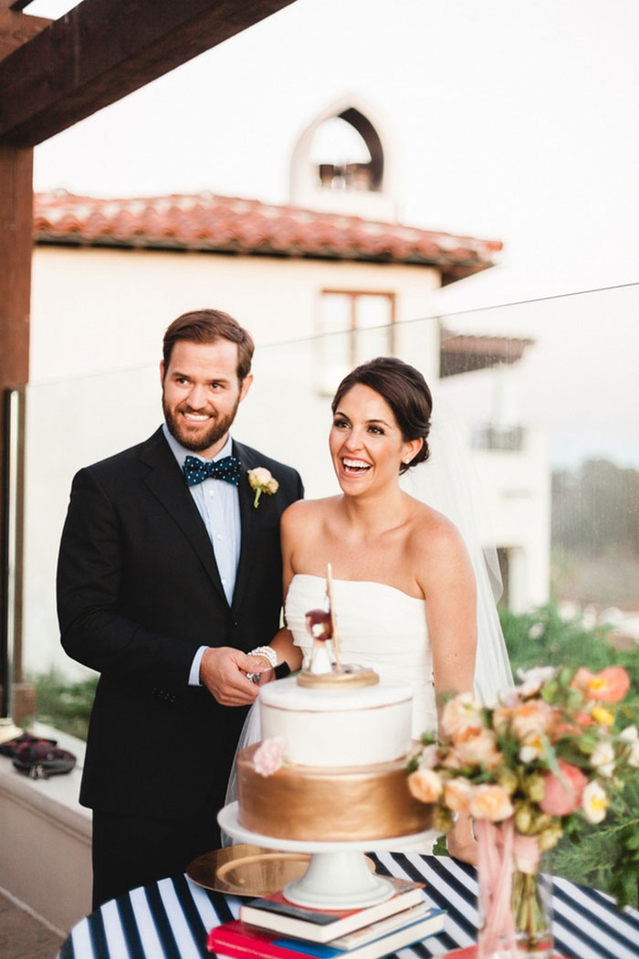 bride and groom cutting the cake