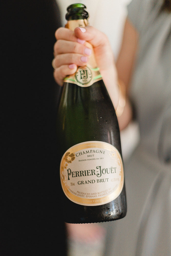 bridesmaid holding champagne