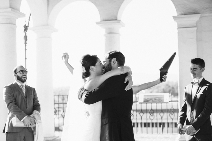 bride and groom first kiss