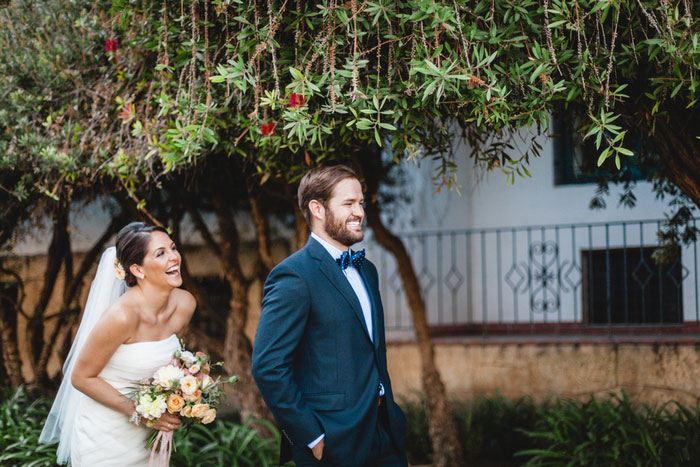 bride coming up behind groom