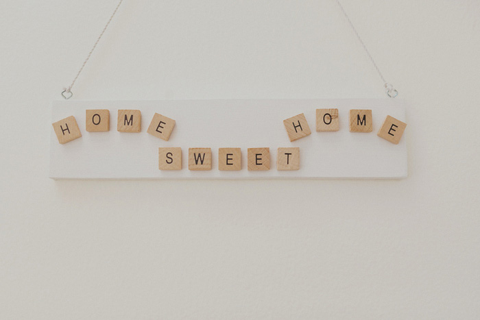 home sweet home sign with scrabble tiles