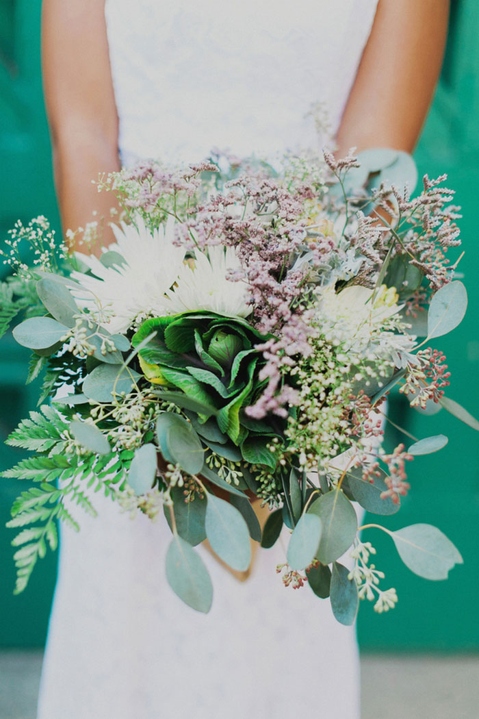 bride holding lush wedding bouquet