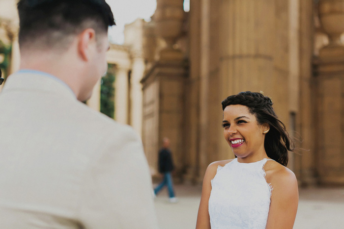 bride smiling at groom during ceremony