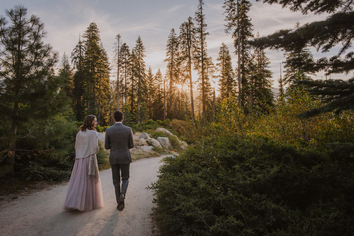 bride and groom walking along path