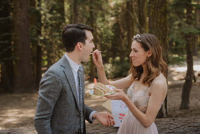 bride feeding groom cake