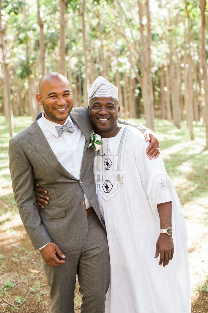 groom portrait with officiant