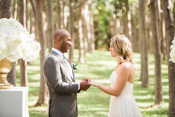 bride and groom holding hands during ceremony