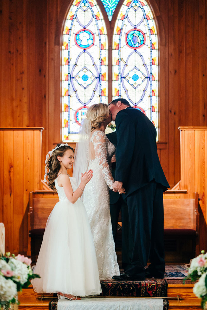 bride and groom first kiss