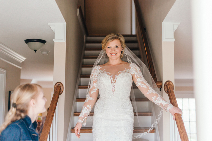 bride coming down the stairs