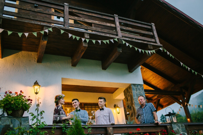 bride and guests on chalet porch