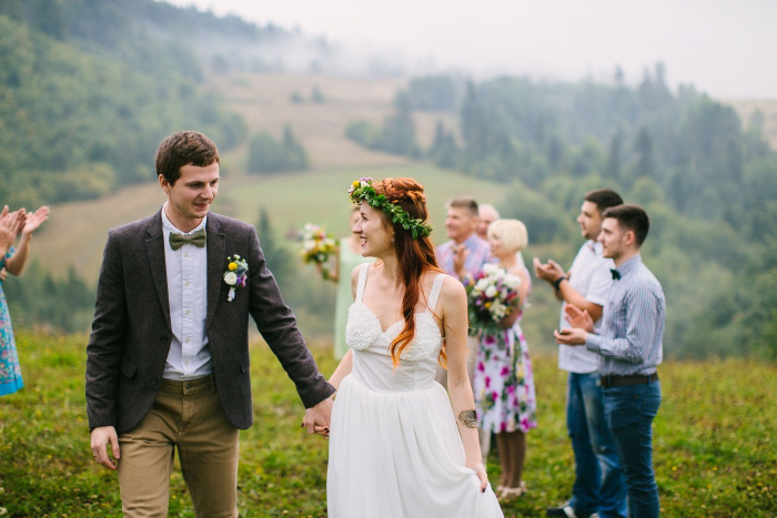 bride and groom walking up aisle