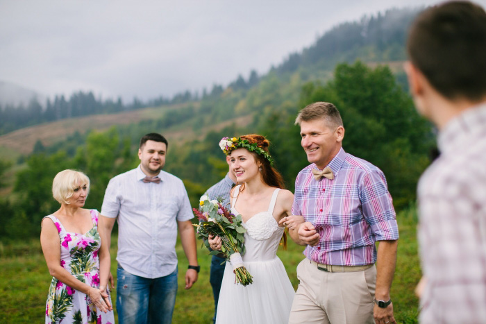 bride walking down the aisle with her father