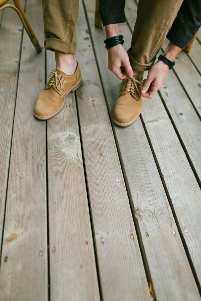 groom tying shoes