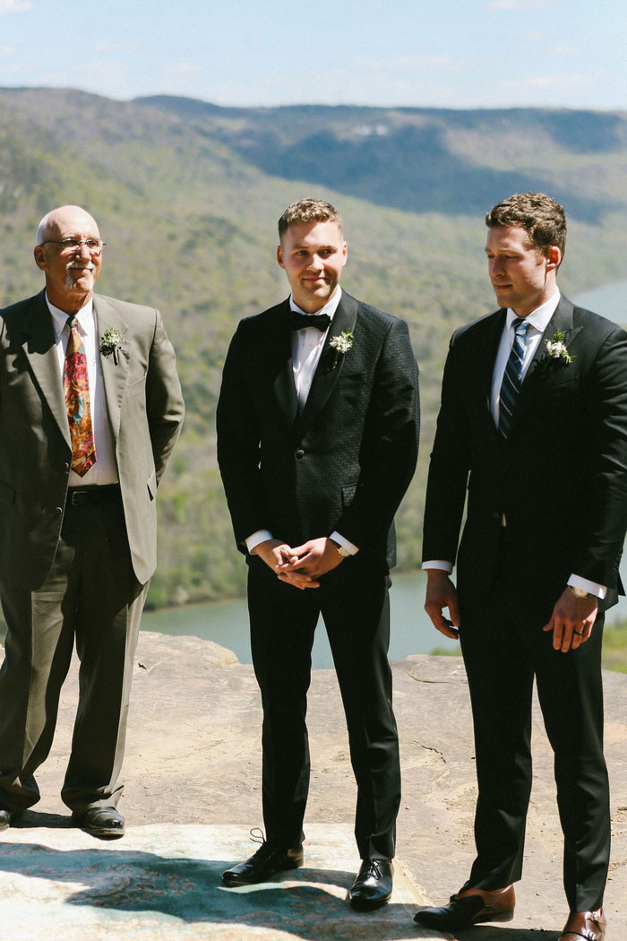 groom waiting at ceremony for bride