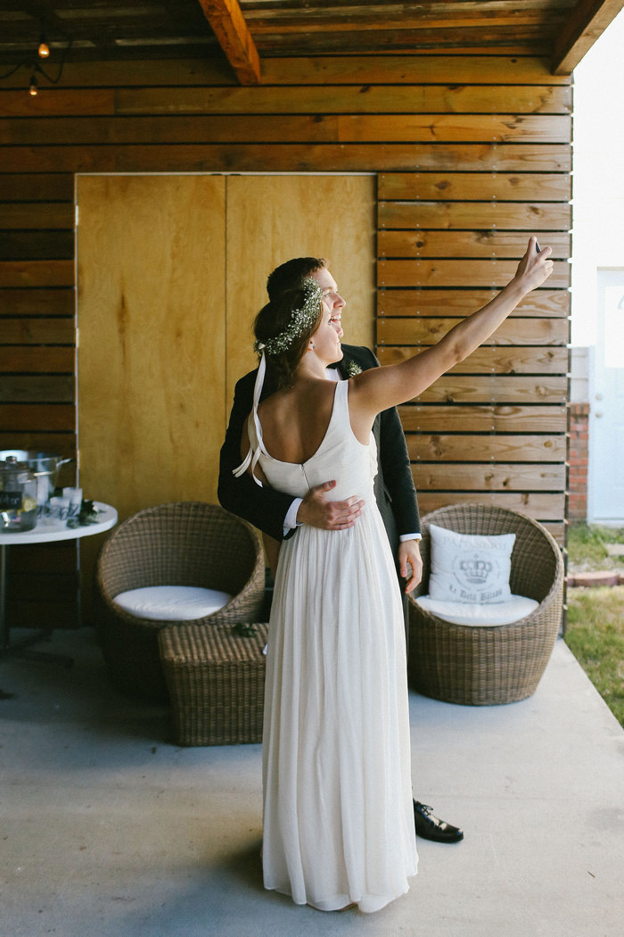 bride and groom taking selfie