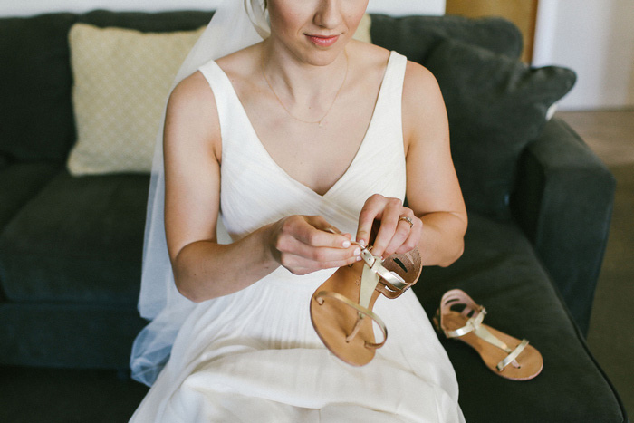 bride putting other shoes