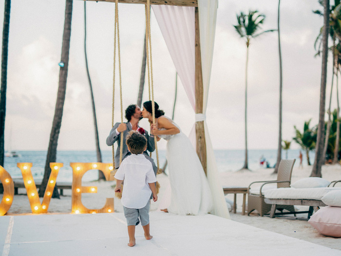 kid photo bombing wedding portrait