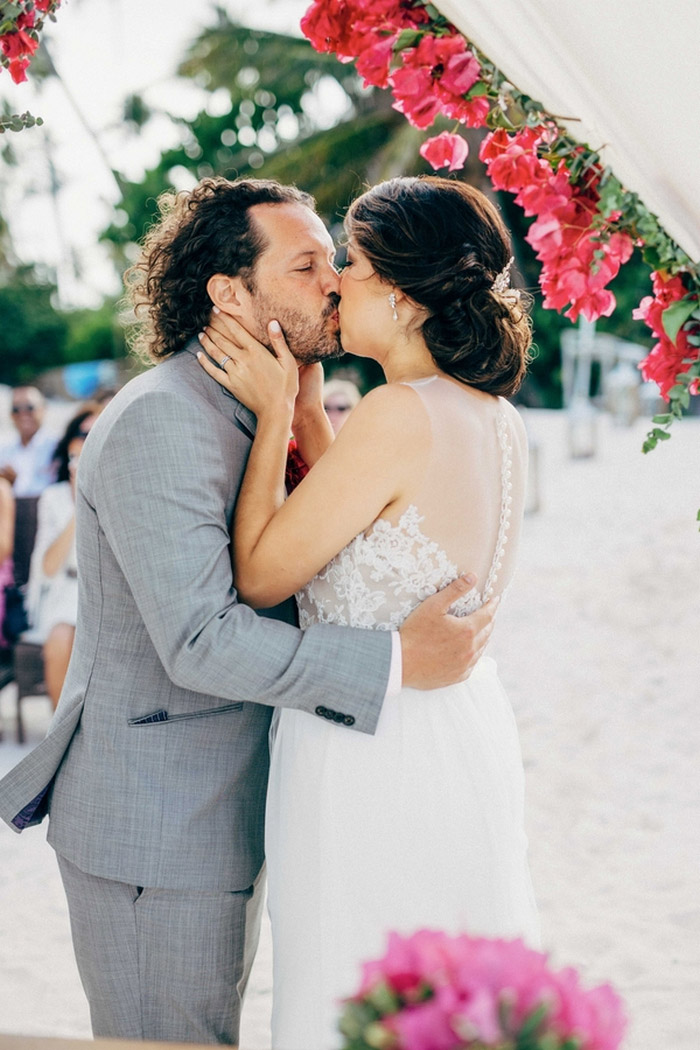 bride and groom first kiss