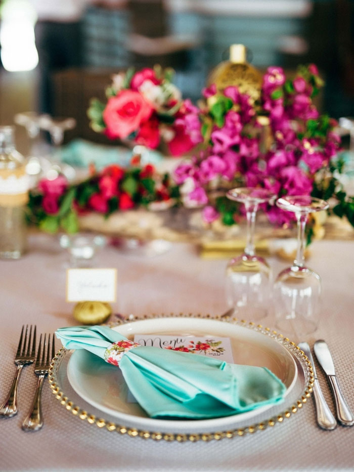 wedding table setting with pink flowers