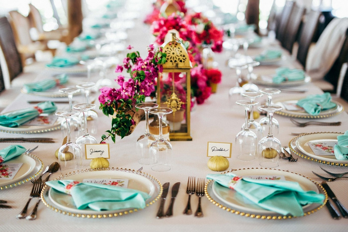 wedding table setting with pink flowers