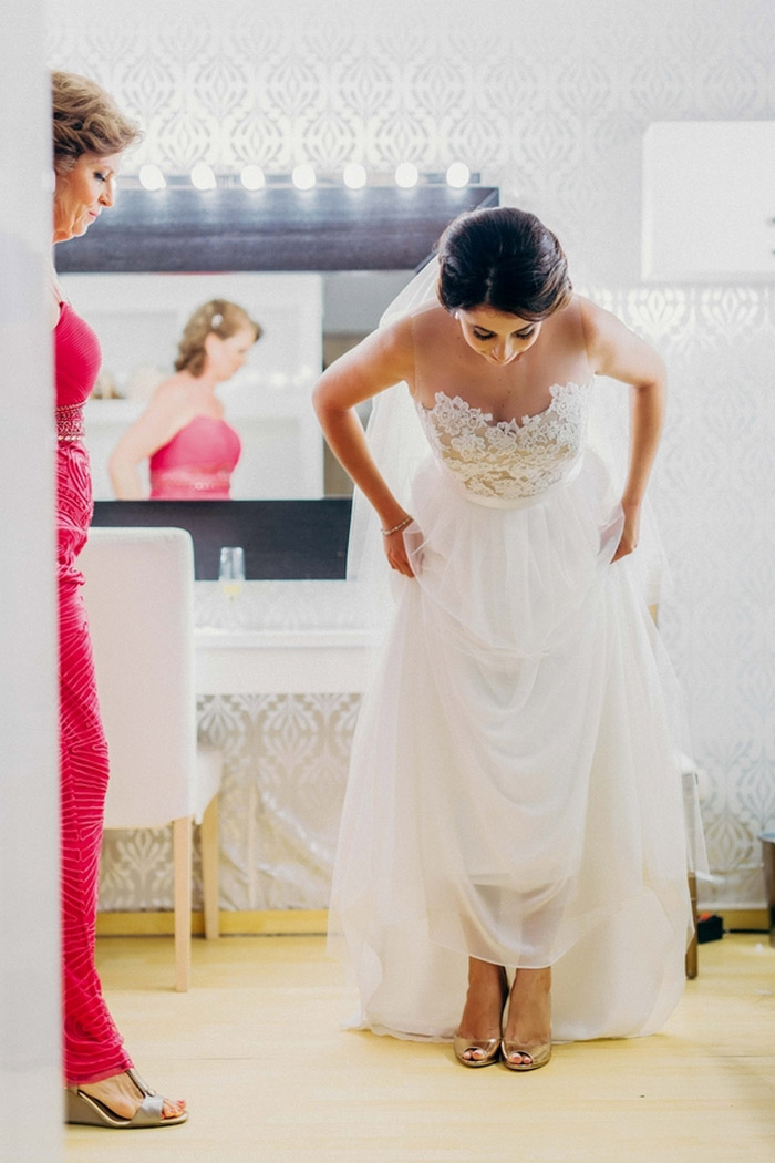 bride lifting dress to reveal shoes