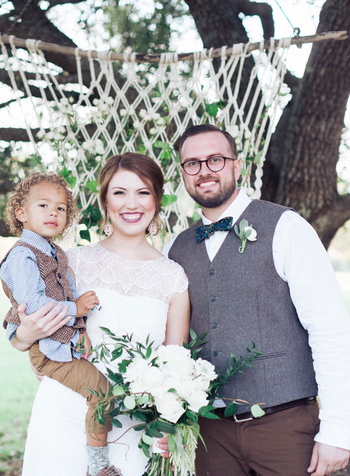 bride and groom with son