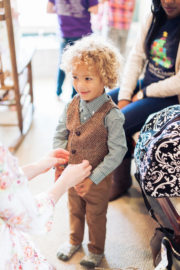 bride dressing son for wedding