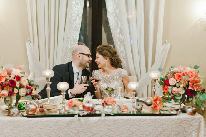 bride and groom at sweetheart table 