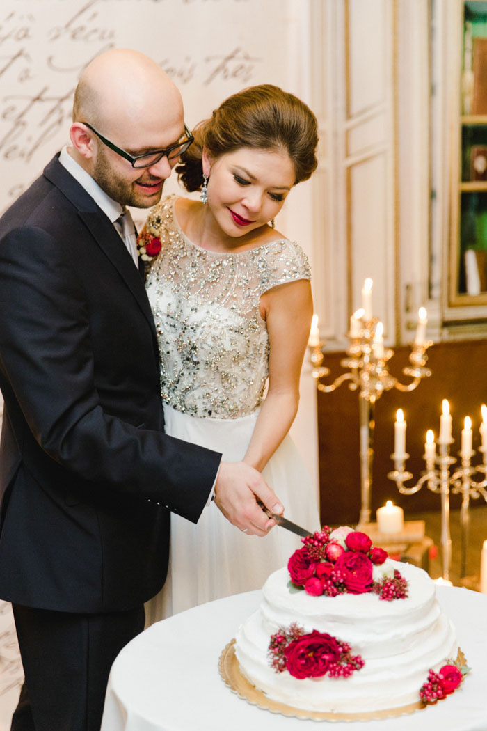 bride and groom cutting cake