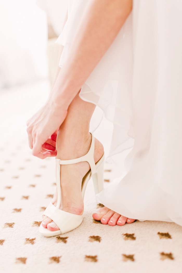 bride putting on shoes