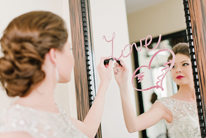 bride writing on mirror