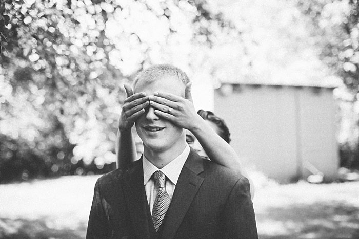 bride covering groom's eye