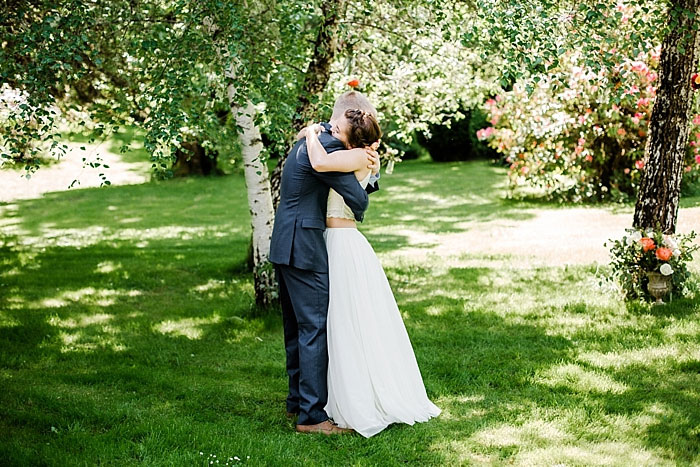 bride and groom hugging