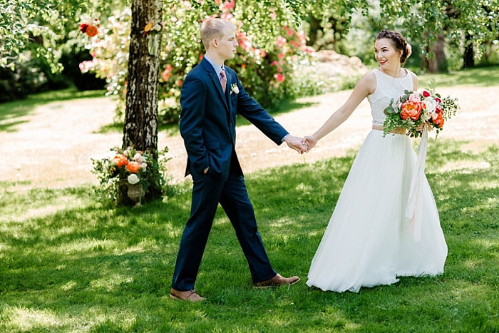 bride leading groom by the hand