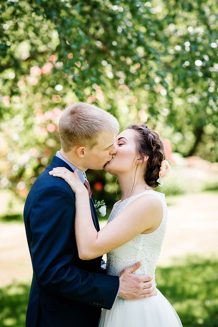 portrait of bride and groom kissing