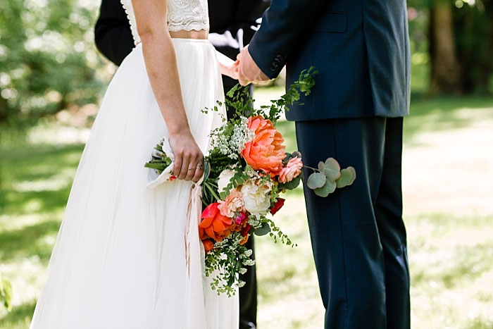 bride holding bouquet during ceremony