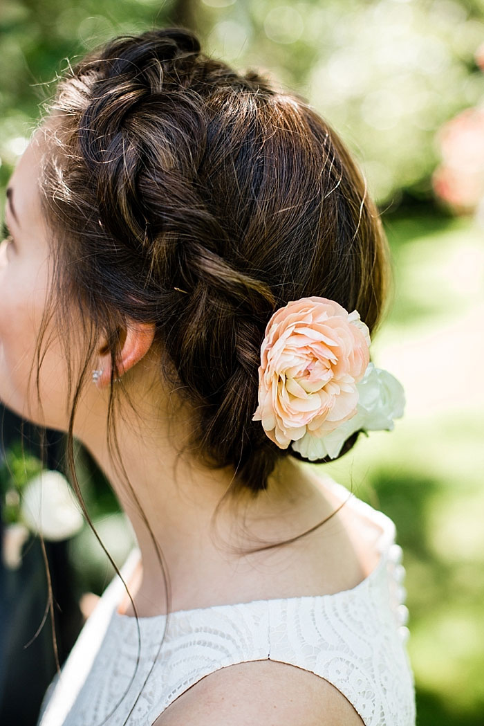 peach rose in bride's hair