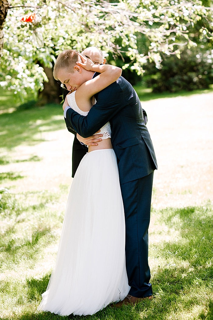 bride and groom embracing