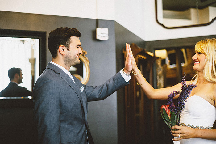 bride and groom high-fiving