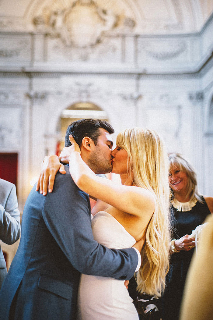 bride and groom first kiss