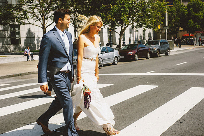 bride and groom crossing the street