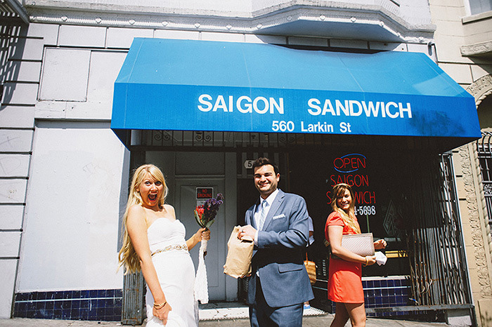 bride and groom outside sandwich shop