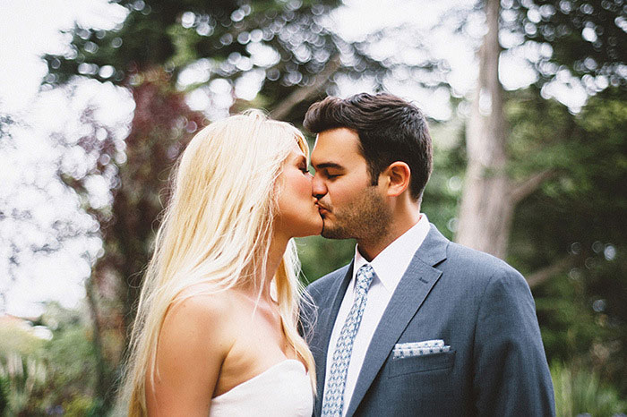 bride and groom portrait kissing