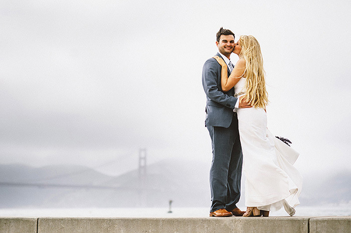 bride and groom portrait with golden gate bridge in background 