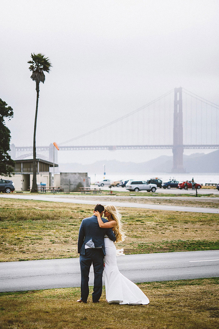 bride and groom portrait by golden gate bridge