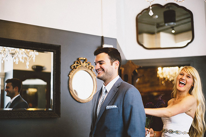 bride tapping groom on shoulder