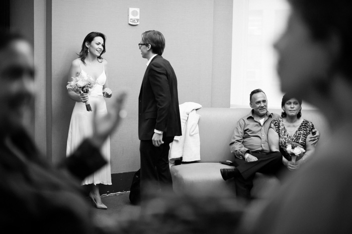 bride and groom waiting at city hall