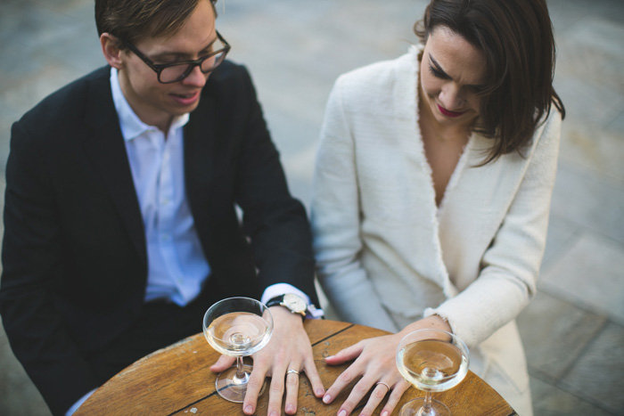 bride and groom comparing their rings